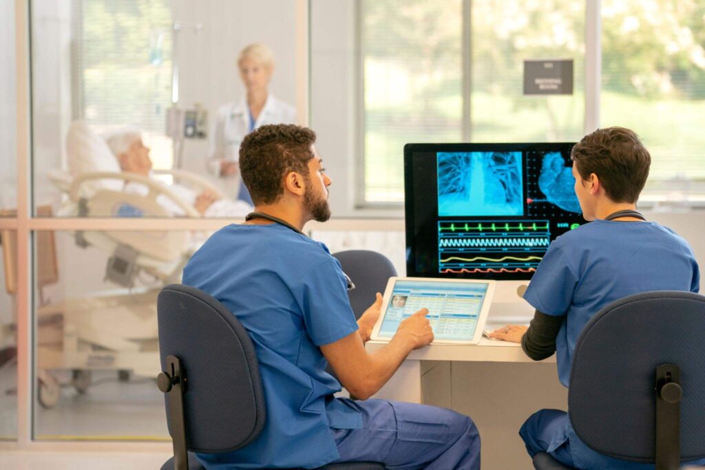 healthcare workers monitoring a patient in hospital